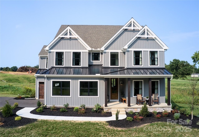 11330 James Coy Rd Covington, Unit Covington, Davidson, NC 28036 - view of front of house with a standing seam roof, roof with shingles, covered porch, and a metal roof
