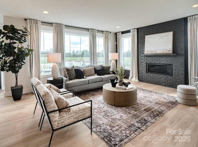 11330 James Coy Rd Covington, Unit Covington, Davidson, NC 28036 - living area with a brick fireplace, wood finished floors, and recessed lighting