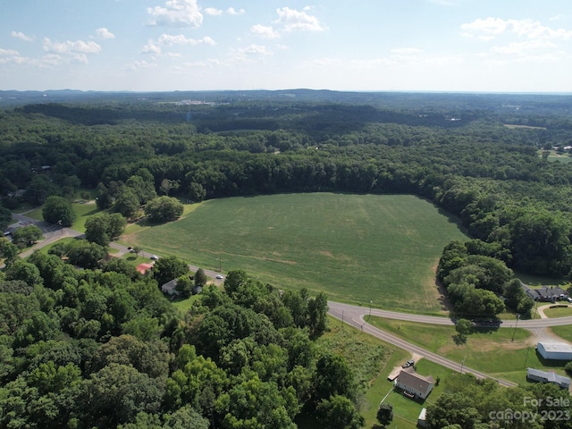 birds eye view of property with a rural view