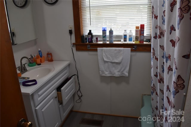 bathroom with vanity and a shower with curtain