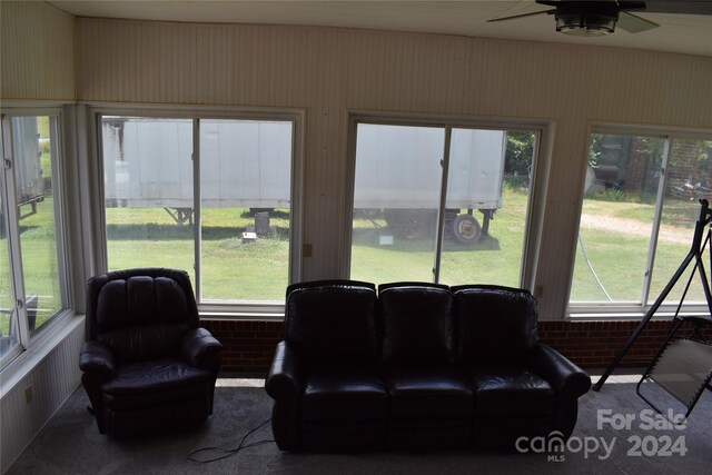 sunroom featuring ceiling fan