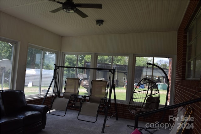 sunroom / solarium with ceiling fan