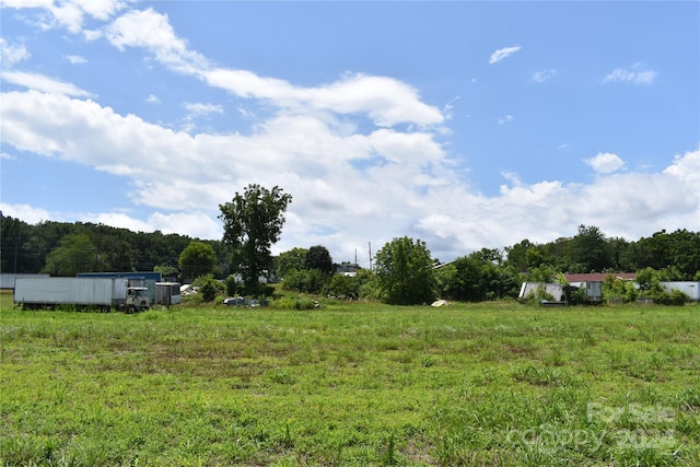 view of yard with a rural view