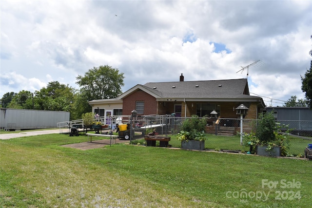 back of house with a yard