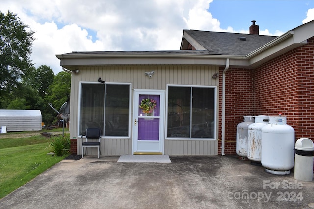 doorway to property with a patio