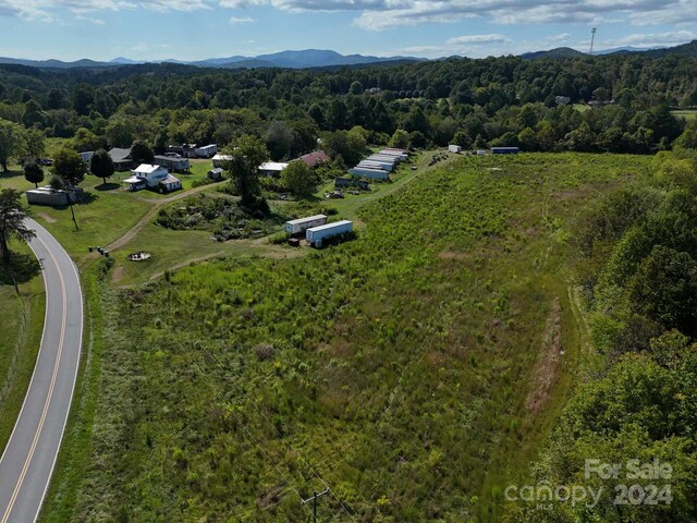 drone / aerial view featuring a mountain view