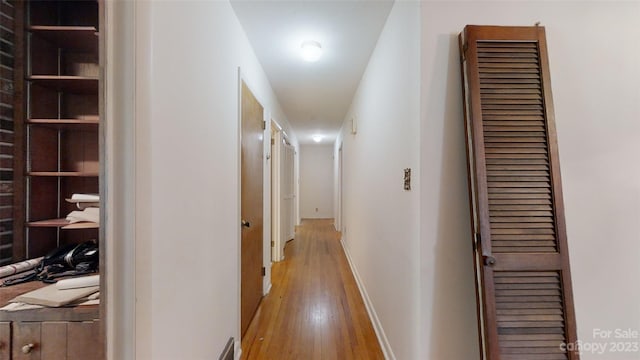 corridor featuring light hardwood / wood-style floors