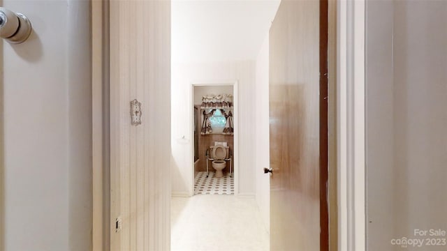 hallway with tile floors