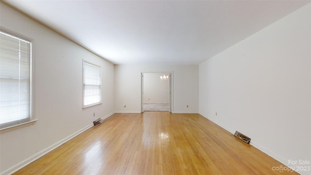 unfurnished room with light hardwood / wood-style flooring