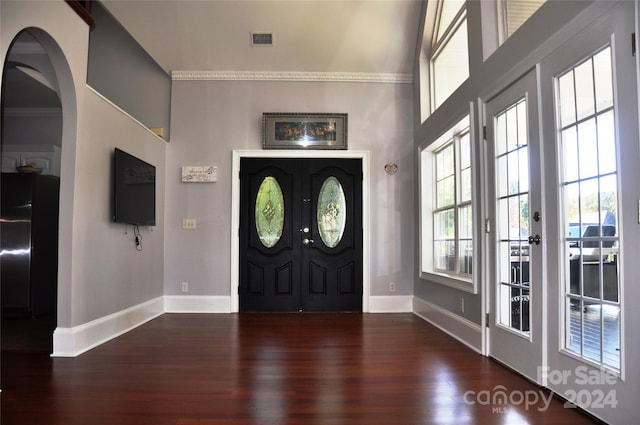 entryway featuring dark hardwood / wood-style floors, french doors, and crown molding