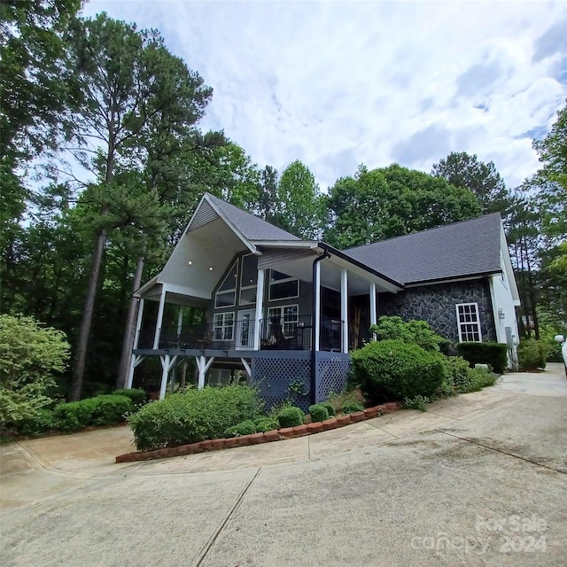 view of home's exterior featuring a sunroom