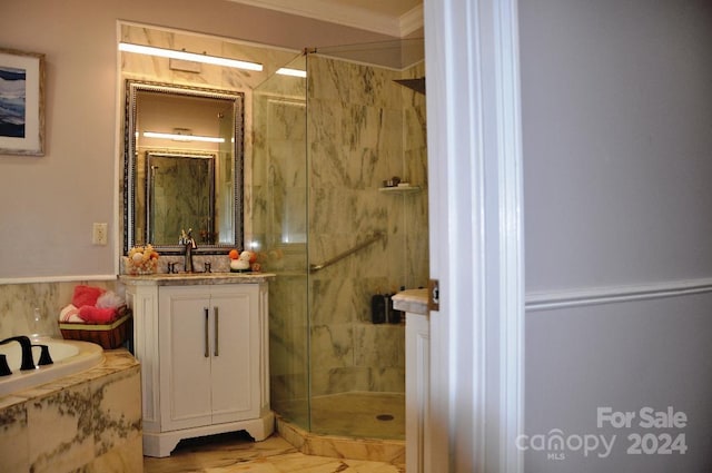 bathroom with vanity, crown molding, and separate shower and tub