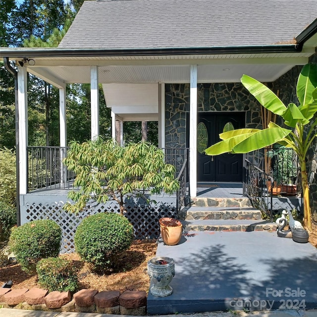 3645 Lake Bluff Dr, Sherrills Ford, NC 28763 - property entrance featuring covered porch, stone siding, and roof with shingles