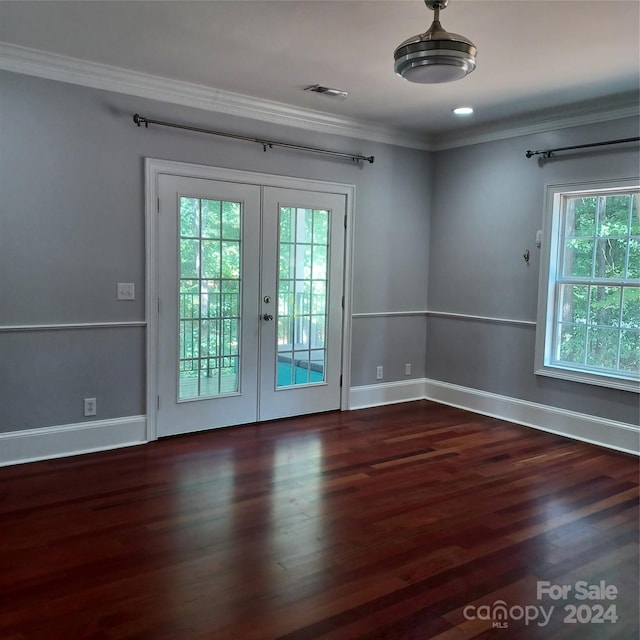 unfurnished room with dark hardwood / wood-style flooring, french doors, and a wealth of natural light