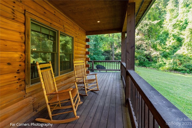 wooden deck with a yard