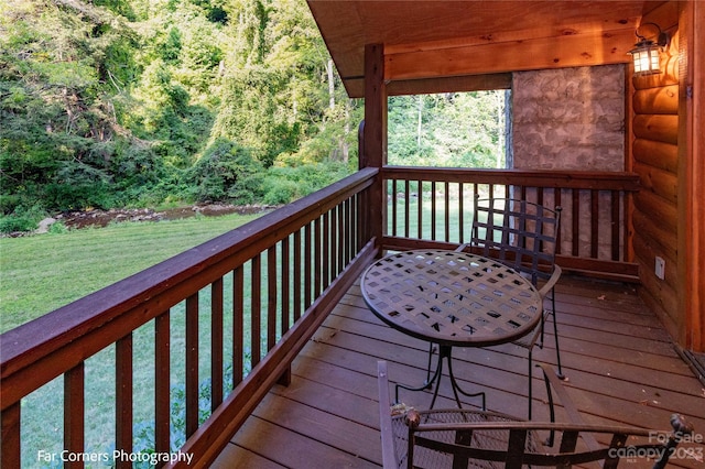 deck featuring a lawn