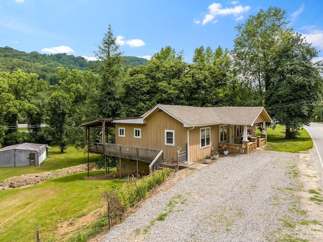 view of front of home featuring a front lawn and a porch