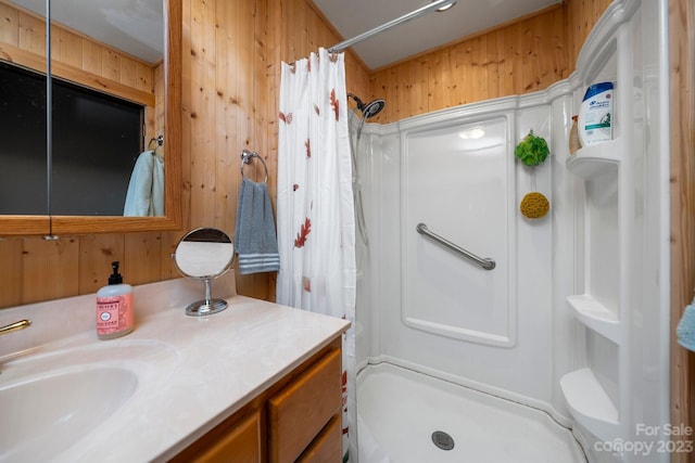 bathroom featuring oversized vanity, toilet, and wooden walls