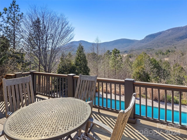 wooden deck with a mountain view