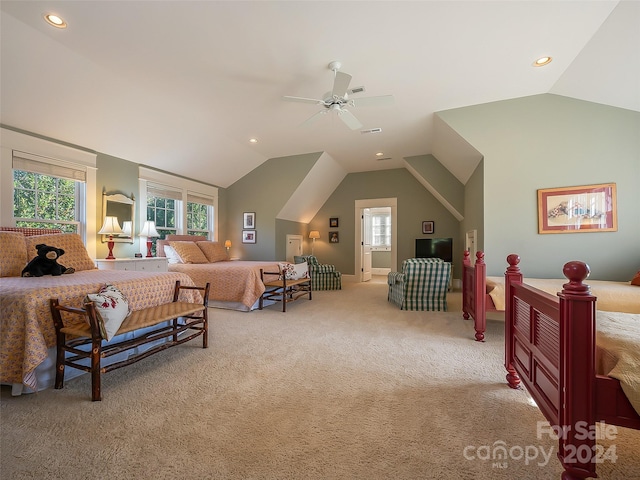 bedroom featuring light carpet, ceiling fan, and vaulted ceiling