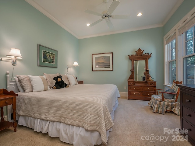 carpeted bedroom with ceiling fan and crown molding