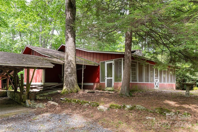 view of front of home featuring a sunroom