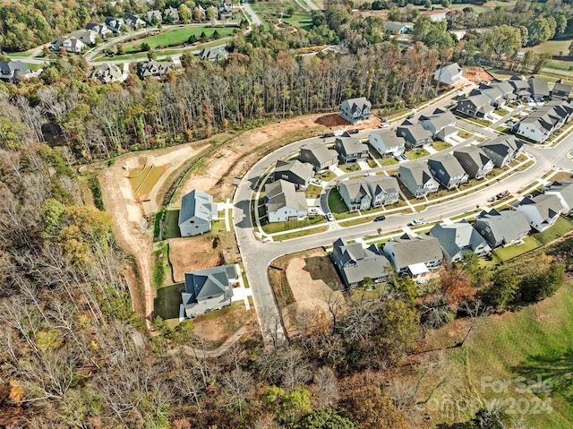 birds eye view of property with a residential view