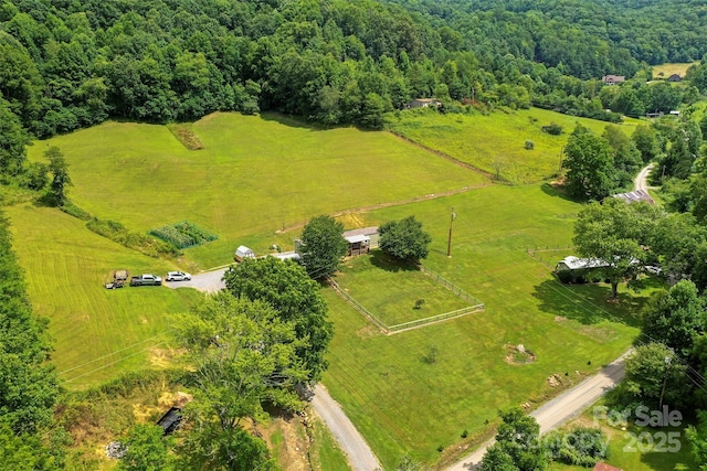 birds eye view of property with a rural view