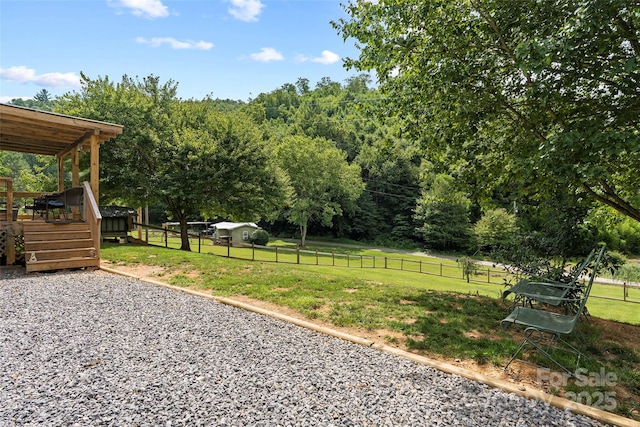 view of yard with a wooden deck