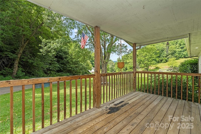 deck featuring a lawn