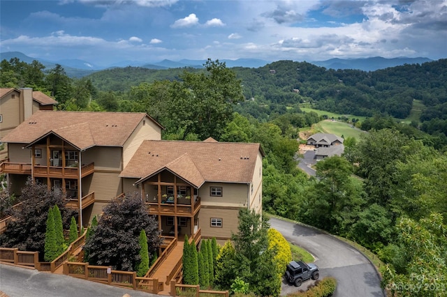 birds eye view of property with a mountain view