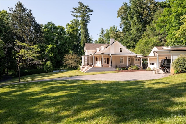 back of house with a lawn