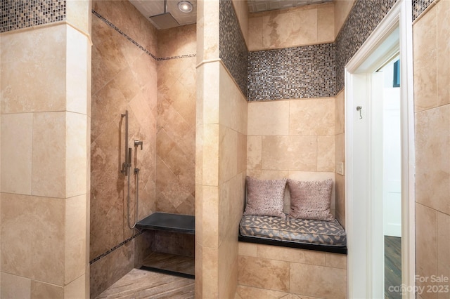 bathroom featuring tile walls and wood-type flooring