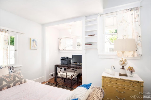 bedroom featuring dark wood-type flooring