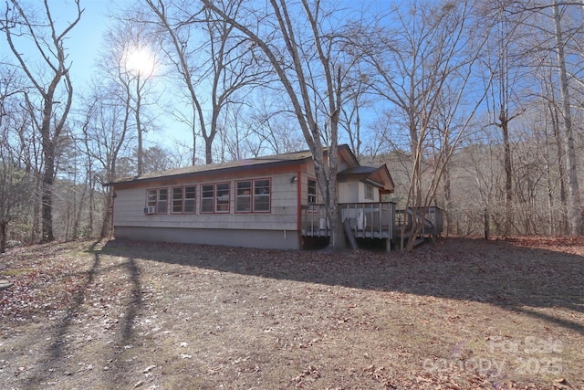 view of front of home with a wooden deck