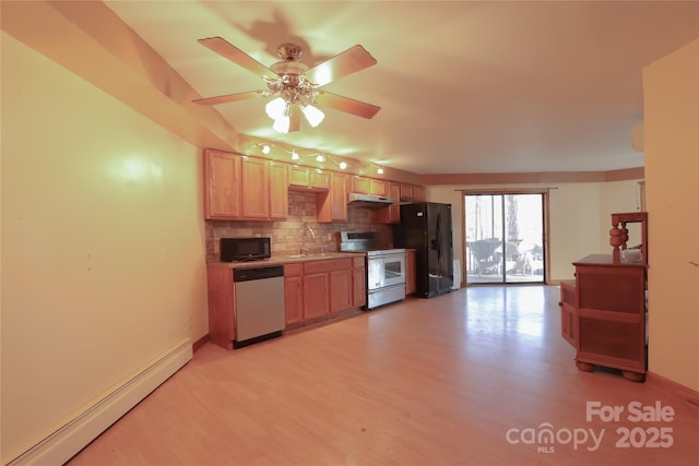 kitchen with ceiling fan, sink, baseboard heating, backsplash, and black appliances