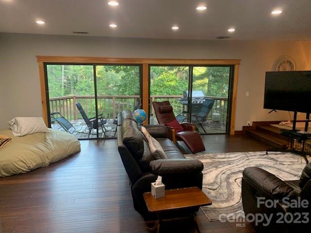 living room with dark hardwood / wood-style floors