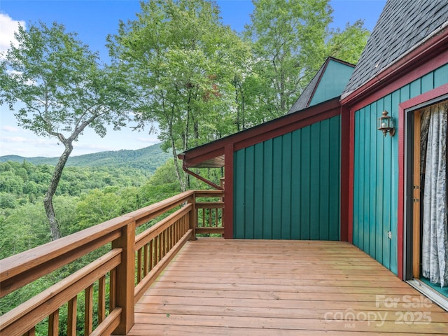 wooden terrace with a mountain view