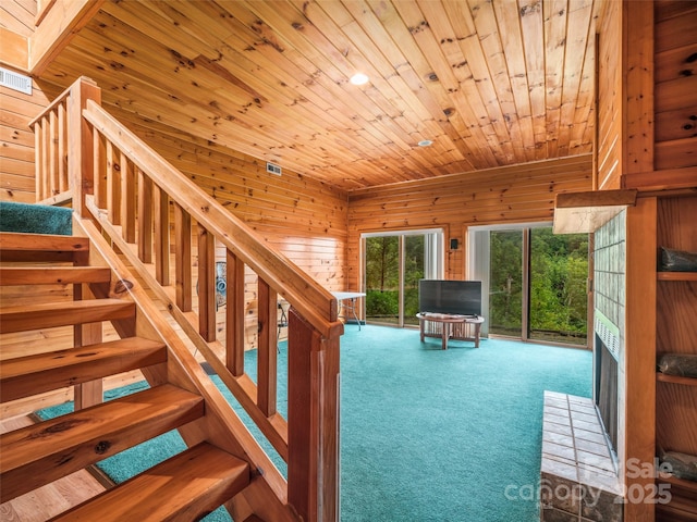 interior space featuring wooden walls and wood ceiling