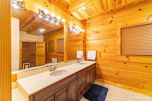 bathroom with beam ceiling, double sink vanity, and wood ceiling