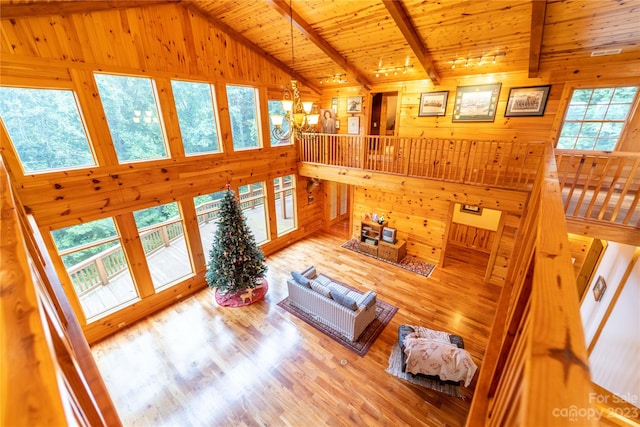 living room featuring plenty of natural light and light hardwood / wood-style flooring