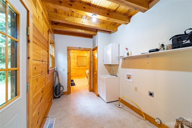 laundry area with sink, plenty of natural light, light tile floors, and wooden ceiling