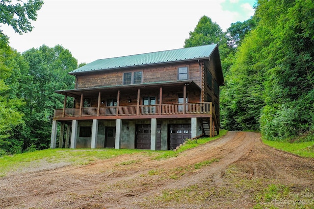 back of house with a balcony