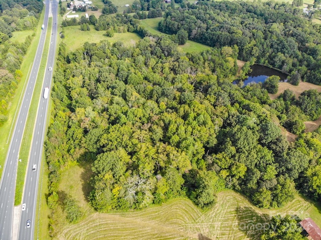 birds eye view of property with a rural view