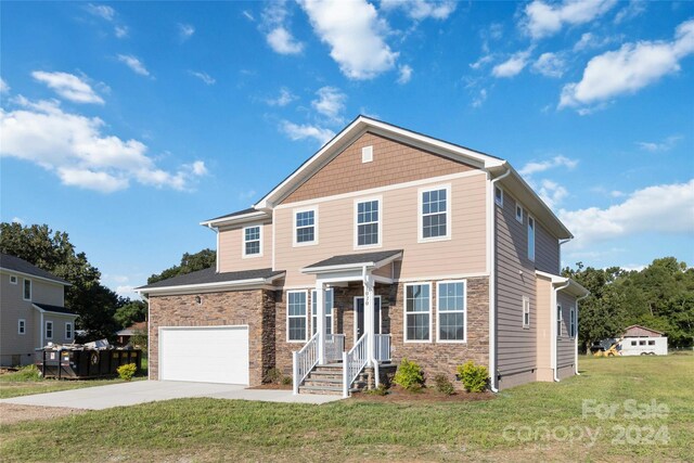 front facade with a garage and a front yard