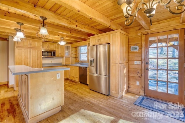 kitchen with decorative light fixtures, a kitchen island, stainless steel appliances, light wood-type flooring, and wood ceiling