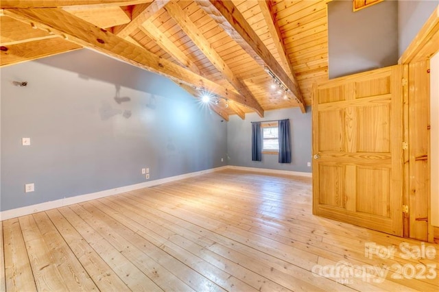 interior space featuring light wood-type flooring, beamed ceiling, high vaulted ceiling, and wooden ceiling