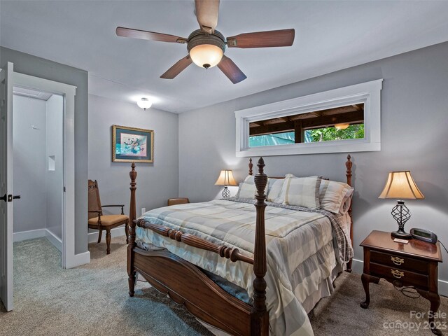 bedroom with ceiling fan and light colored carpet