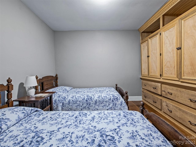 bedroom featuring dark wood-type flooring