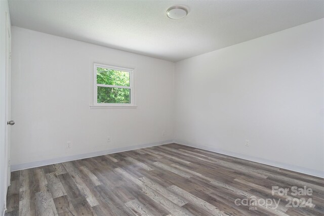 spare room featuring hardwood / wood-style flooring